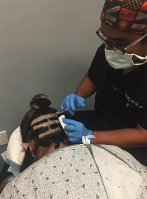 Patient getting treatment for Follicular Unit Extraction at L&P Aesthetics